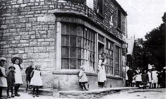 George and Arthur Holbrook's Drapers and Grocery Store on Maggs Hill. The small shop further up Maggs Hill on the left was a bread and cake shop. This picture was taken in the early 1900s.