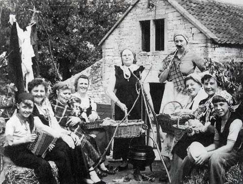 Women's Institute Carnival Float for a village fete in the 1950s. Left to right are: Andrew Pickford, Margaret Pickford, Kitty Hodder, Isobel Tucker, Ivy Tucker, unknown, Winifred Watts, Betty Bridges, Vera Tompkins and Peter Tompkins.