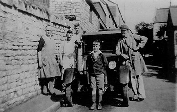 Abbott's Baker Shop at the bottom of Maggs Hill with the delivery van. Shown from left to right are Mrs Abbott, S Fry, Colin Abbott, Shilling Moon (front) and A Abbott.