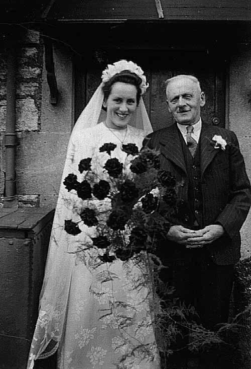 Doris Gladys Helps (nee Gregory) with her father Ernest Gregory at her wedding at The Tabor Chapel in 1950. The reception was held at Kingwell Hall.