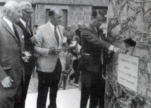 Bernard Cayzer laying the foundation stone of the Conygre Hall in 1973. Left to right are L Brewer (Chairman of the Development Committee), J Crozier (who designed and built the Hall) and Arthur Moon (Chair of the Parish Council). In the background is the old Miners' Welfare Hut.